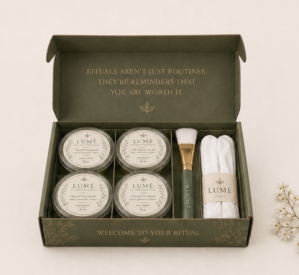 The LUMÉ First Ritual Kit complete in its olive box, with Ritual Brush and Ritual Glove