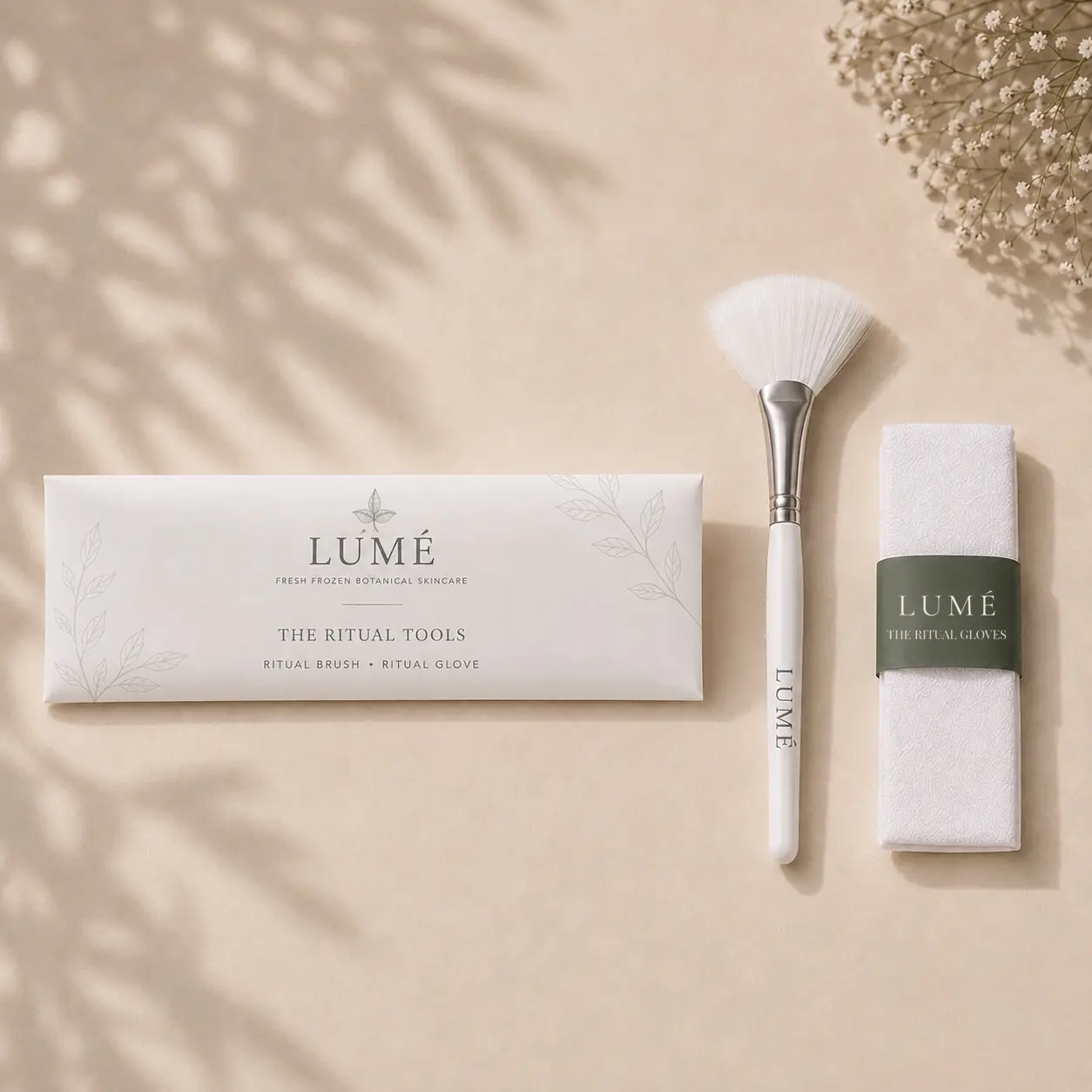 The official LUMÉ Ritual Tools: the Ritual Brush and Ritual Glove in their box